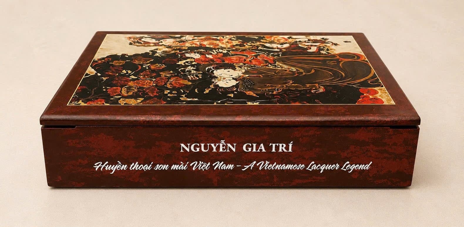 The front edge of the Collector's Edition box, its title engraved in white on deep red lacquer beneath the inlaid lid panel